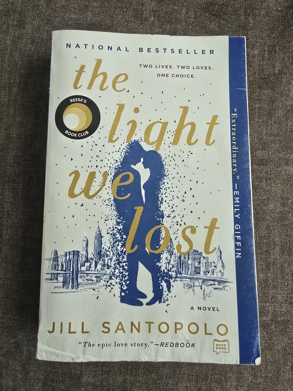 4/$12 The Light We Lost by Jill Santopolo - Blue & Gold Paperback